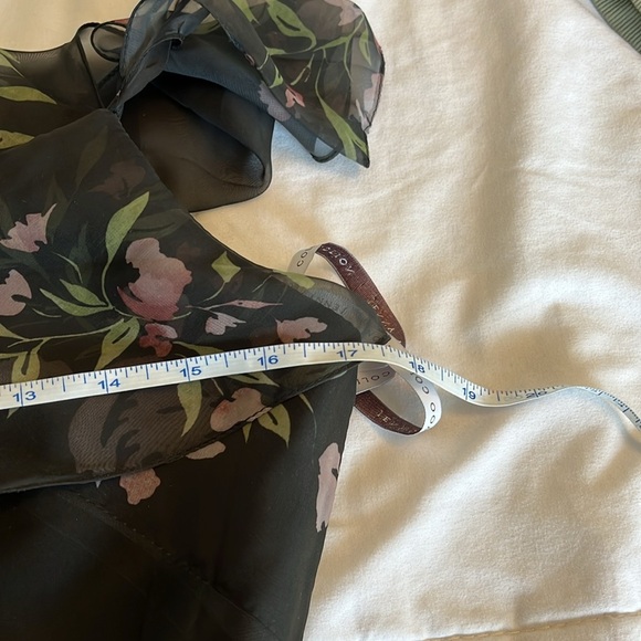 Jenny Yoo Cassie
Flutter Sleeve
Surplice Gown
Black with Floral Pattern. - Picture 14 of 17